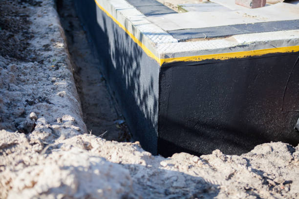 Professional Waterproofing technician working in Forest, VA